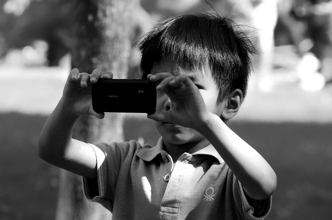 children taking photos