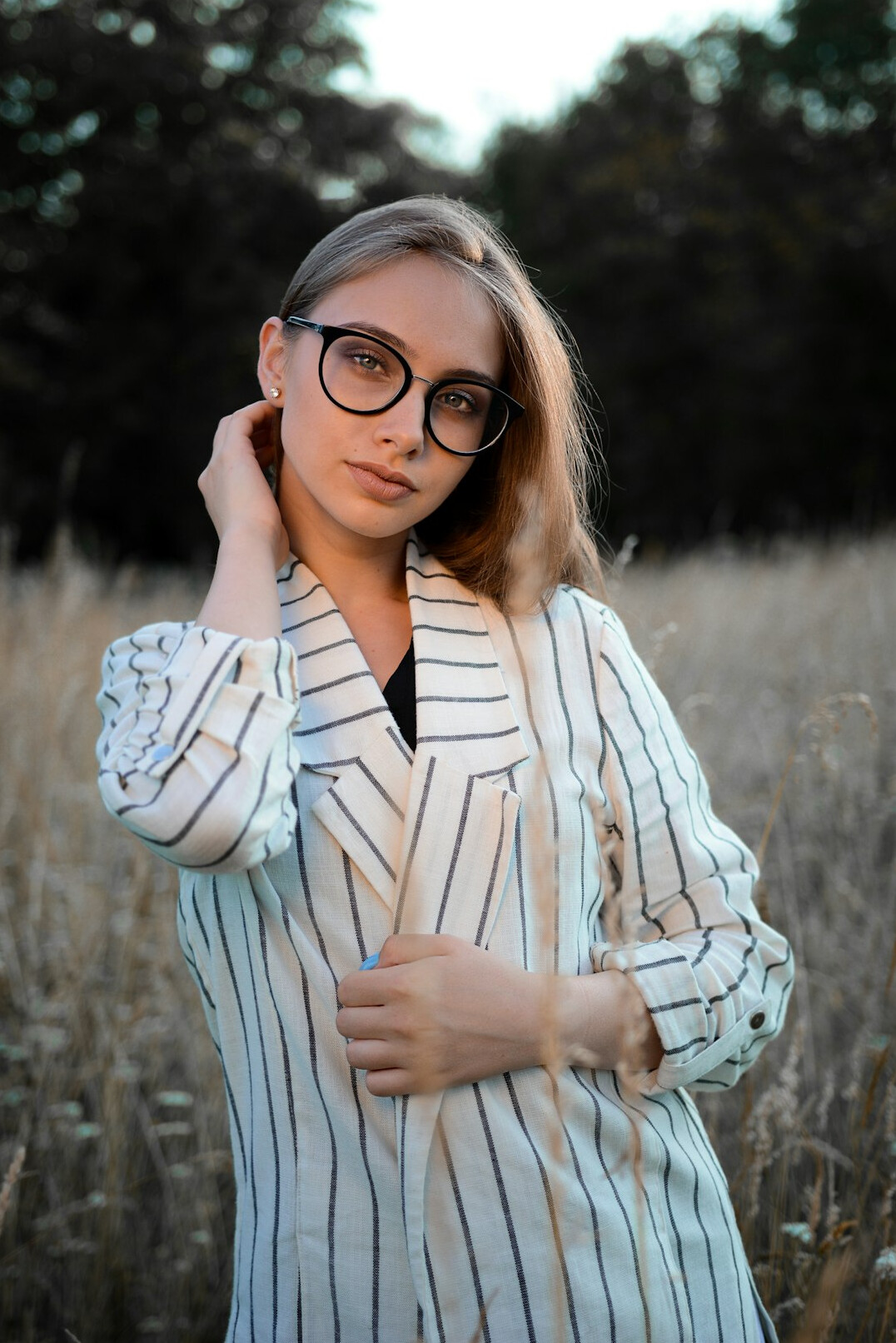 Portrait of a young Danish woman journalist with glasses