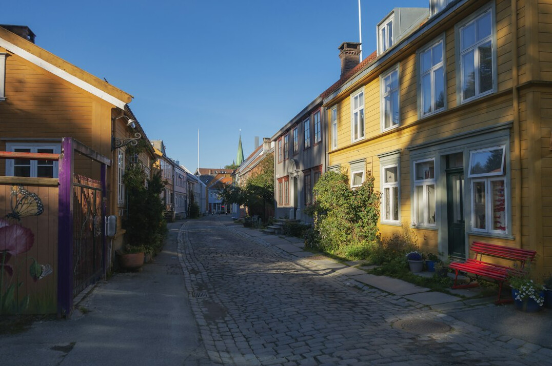 Narrow cobbled street in a small Danish coastal town with colorful houses