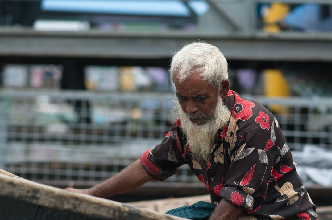 elderly fisherman on boat